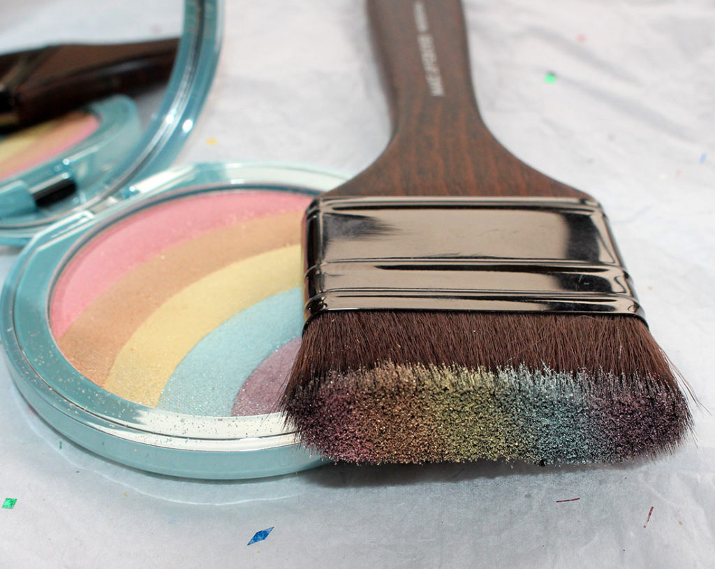 Too Faced Rainbow Strobe Highlighter on a MUFE Brush