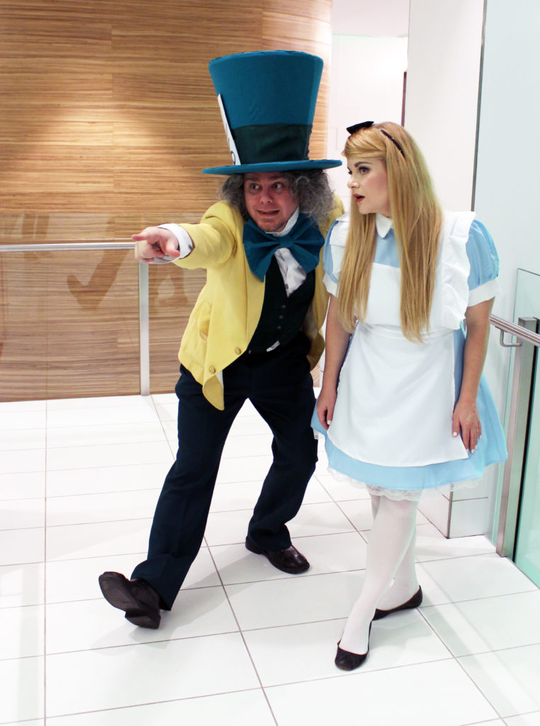 The Mad Hatter telling Alice where to go